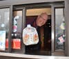 Teacher Mark Bradbury work at the drive-thru