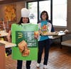 Gloria Gedde sells pies while Sandra Fuller wears the costume during Washington MS McTeacher's Night