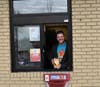 Grant Hopper works the drive-thru during a FUNdraiser at McDonald's in Aurora