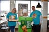 Debbie King and Julie O'Connor take a picture with Principal Covarrubias at McTeacher's night in South Elgin
