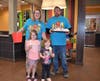 Kylie and Corryn Thill take a picture with Principal Koenig and Pastor Rozelle while enjoying their Vanilla Cones