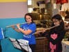 Mridula Pradu and Mrs. Young enjoy playing the violin together at McTeacher's Night