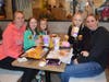 Kelci Jaburk and Lilly and Ellie Abraham are happy to be eating McDonald's served by their teachers.