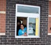 Principal Ms. Jacci works the drive-thru