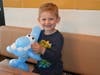 Weber Ingala takes home a shark balloon at the Plainfield McDonald's Grand Re-Opening festivities.