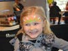 Savannah Mittman is all smiles with her face painted as a crown, celebrating the Grand Re-Opening at Elburn McDonald's