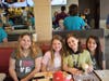 Maddie McReynolds, Addison Martis, Deja Anderson, and Daisy Anderson are happy to see each other at McTeacher's Night