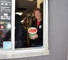  Mr. Biddle works the drive-thru during the school fundraiser