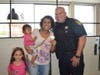 The Pantoja Family enjoys a cone with officer Creighton.