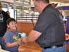 Angel Prado was very excited to receive a free Slushie from Detective Marc Hornsby at the Larkin Avenue McDonald's 