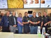 Area Supervisor Matt Romaine and General Manager Ron Hornsberger take a picture with Elgin Police