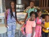 The Merveille Family gets outfitted in new backpacks for the new school year.