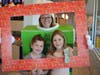 ​Claire Zeschke and Heather Kunstman were happy to see teacher Tucker in a pie box.