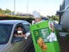 ​NIU student Randy Parent supports Malta Elementary school by buying a pie in the Drive-Thru.
