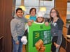 WDJH students Benjamin Sanchez, Lina Curiale, dressed as a pie, and Gianna Gary take a picture with Principal Skarzynski at McTeacher's Night in Bensenville