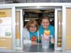 MaryKulaga and Anita Strassman work hard at the Drive-Thru to support WelchElementary School.