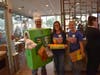 Mrs. McGann as pie seller, Mr. Hamann dressed as a pie and Ms. Martens working the kiosk all pose for a picture during McTeacher's Night in Wheeling