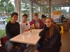 Nataliah Czajkowski, Ricky Singh and Carlos Moreno, Edwin Ochoa are happy to see Mrs. Bermudez during McTeacher's Night for Holmes MS