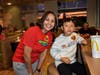 Student Paul Yoon was very happy to see Principal Johnson at McDonald's during the schools McTeacher's Night