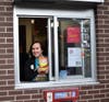 Mrs. Puttin works the Drive-Thru at the Batavia McDonald's during McTeacher's Night