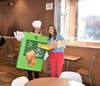 Mrs. Smith is dressed up in a pie costume while Ms. Gosse sells pies alongside her at the St. Joseph McTeacher's Night in Elgin on Larkin Avenue