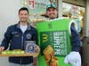 Northwest Chargers Hockey coaches Ryan Zanon and Colin VanHauter are all smiles selling delicious apple pies during the McCoaches Night held on October 21st at the Mt. Prospect McDonald's.