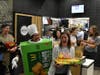 Carolina Arroyave and Alyssa Ruffolo dance as they sell pies at McTeacher’s Night