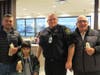 Niles Police Officer Rod Whiteman enjoyed making and handing out delicious vanilla cones to Niles residents Jonathan and Joseph Mikhael and Found Shamoon during the Cone With A Cop event at the Niles McDonald's on October 30th.