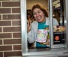 HC Storm Principal Anne Paonessa works the drive-thru during McTeacher's Night at the Batavia McDonald's on Wilson Street