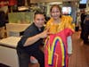 Batavia McDonald's General Manager, Omar Daniel, takes a picture with HC Storm Student Aliaa Mohamed who was dressed as a McDonald's Fy Box for McTeacher's Night