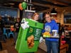 Diana Lipman, Principal, wears an apple pie costume while PTA President Peggy Frank sells pies alongside her during Neil Armstrong Elementary schools McTeacher's Night
