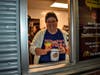 Special Education Assistant, Sarah Norman works the drive-thru at the Hoffman Estates McDonald's during Neil Armstong Elementary Schools McTeacher's Night