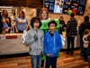 Armstrong students Christian Campos and Presley Lingeman are all smiles with Principal Lipman dressed as an apple pie box during Armstong Elementary school McTeacher's Night in Hoffman Estates