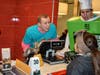 Assistant Principal Jordan Thorse takes a students order while Principal Carol Betzold assists in a pie costume 