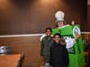 Dylan and Aayden Jeffery are happy to see teacher Christenson in an apple pie costume during McTeacher's Night in Elgin