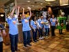 The Washington Elementary school staff does the wave during the school's FUNdraiser at McDonald's in Elgin