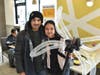 Elizabeth holding her giant dragonfly alongside her dad, Luis. at the Niles McDonald's Grand Re-Opening Events