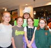 Mave Heneghan,Fiona Heneghan, Chloe Dore, and Mykala Diskin were thrilled to see teacher Hecker in the pie box