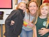 Michaela Fischer and Maia Traba were so happy to hug teacher O'Connor at McTeacher's Night.