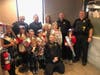 The reigning area queens take a picture with The officers (from left to right) are Chief Wermes, Officer Bognar, Deputy Chief Botterman and Officer Jacobson.  Sgt. Lewakowski is in the front. 