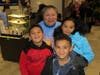 Nelson Elementary School Librarian Maria Navas is surrounded by Nelson School students Dylan Lopez, Alexia Lopez and David Lopez during the McTeacher's Night held on January 16th at the Niles McDonald's.