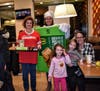 Annie Garbe, Peyton Dempsey, and Home and School Vice President Laura Dempsey were happy to take a picture with Holy Cross teachers and pie sellers Kamia and Vaja during McTeacher's Night
