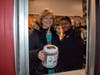 McDonald's Employee Tamir Beecham shows Second Grade Teacher Janet Schultz how to work the drive-thru during the Elizabeth Ide Elementary McTeacher's Night