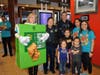 Angelina, Aalayah, and Amya Vega are very excited to take a picture with some of their school teacher's and Officer Farrell, and Officer Snow during McTeacher's Night for Coleman Elementary
