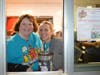 Annie Cusack and teacher Murawski work the Drive-Thru window to support Saint Christina.