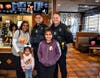 Alexi and Brianna Porras were very happy to take a picture with Principal Robinson, and Officers Ramirez and Engelke during Lowrie Elementary's McTeacher's Night in Elgin