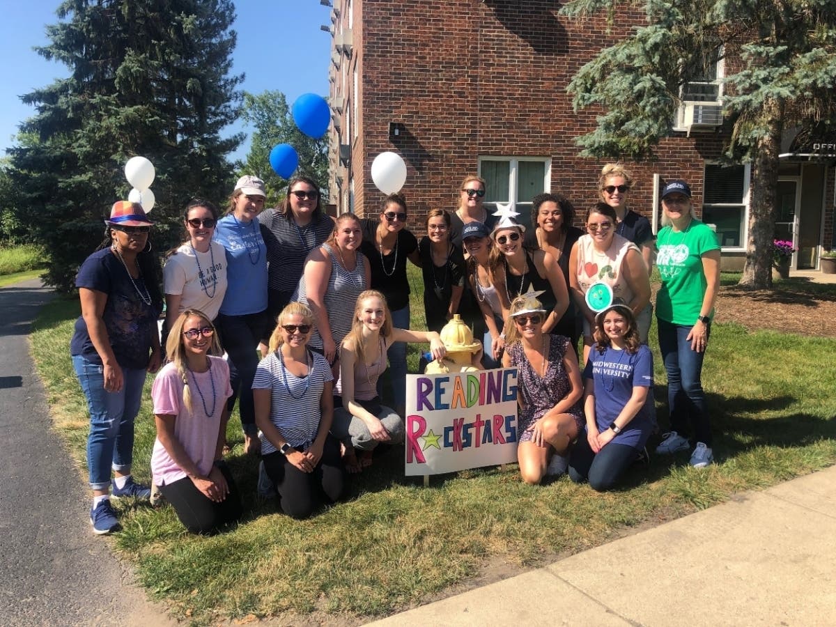 Students from Midwestern University Speech-Language Pathology Program host a Reading Rockstars event for children.