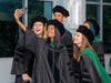 Students from a variety of academic programs celebrate their graduation from Midwestern University. 