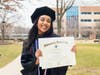 Sneha Reddy Maddi of Eagan, MN, shows off her diploma following a commencement ceremony for Midwestern University’s College of Pharmacy, Downers Grove.