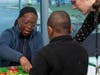 A young patient participates in an educational activity at the Give Kids a Smile event.